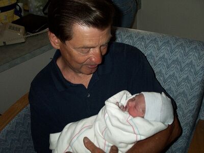 Grandpa Ted holding me for the first time