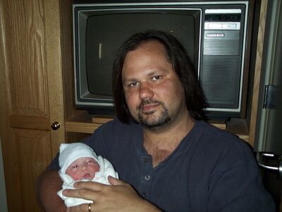Daddy holding me for the first time…aren't we cute?