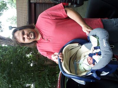 Daddy holding me in the carseat…I'm not heavy yet
