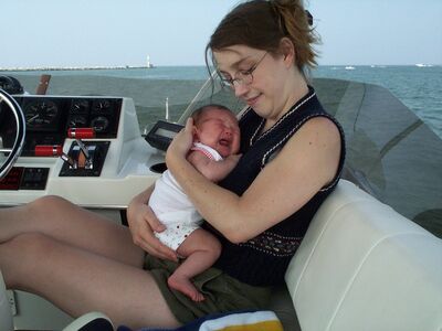 Mommy holding me on the boat