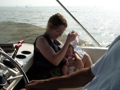 Mommy holding a cover over me so I don’t get too much sun