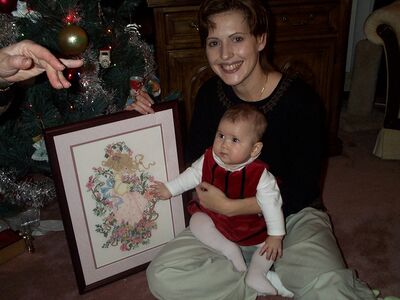 Aunt Anita holding me with my picture she made
