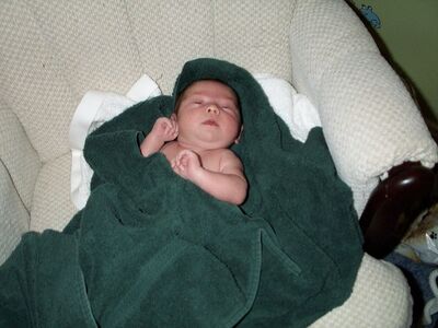 Me wrapped in a green towel