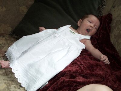 Me in white dress yawning