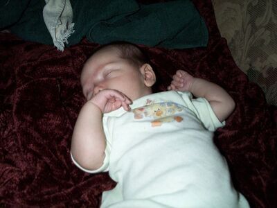 Sleeping in the Suzy's Zoo onesie