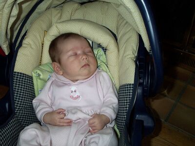 Me in the carseat, pink cat outfit