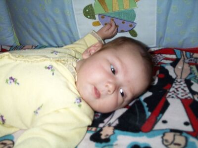 Me in the yellow sweater in the crib