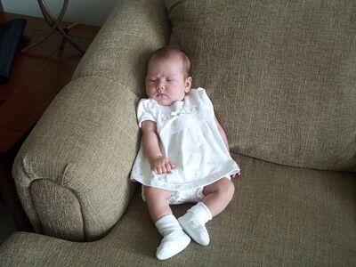 Me sitting up in my white dress