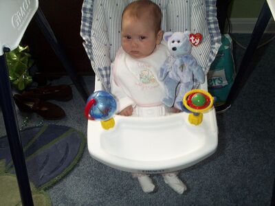 Me in the swing with my Mommy bib