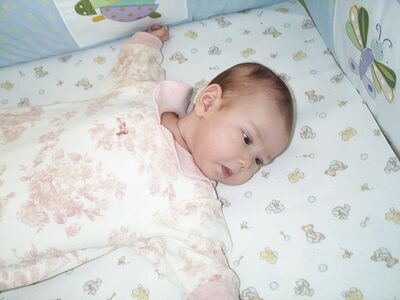 Me in pink toile outfit in crib