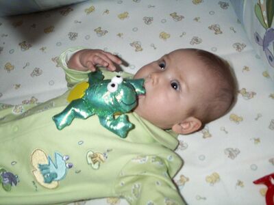 Me in green frog outfit eating frog