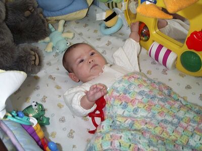 Me playing in the crib
