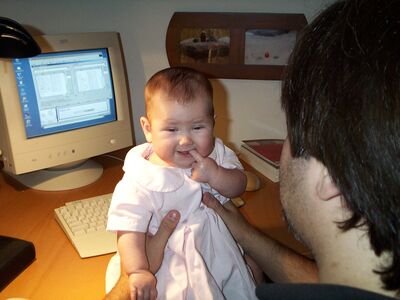 Daddy holding me in computer room
