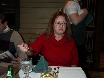 Grandma Diane looking funny getting a spoon of water for me