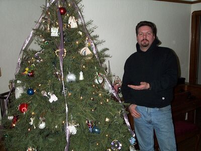Pete by the Christmas tree
