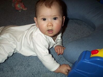 Me in the white puppy outfit crawling