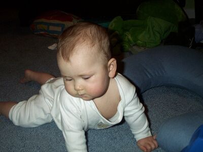 Me in the white puppy outfit looking down