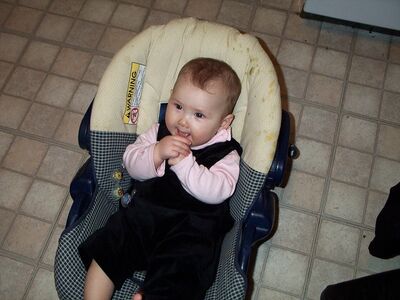 Me smiling in my carseat