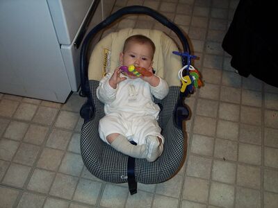 Me in the giraffe outfit in the carseat