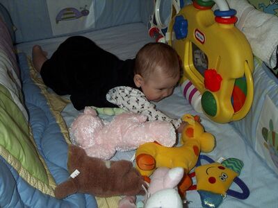 Me playing in crib