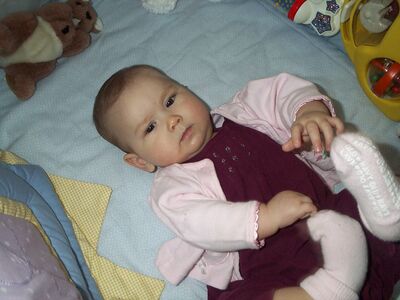 Me in pink outfit playing with my feet