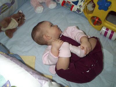 Me in pink outfit playing with my feet