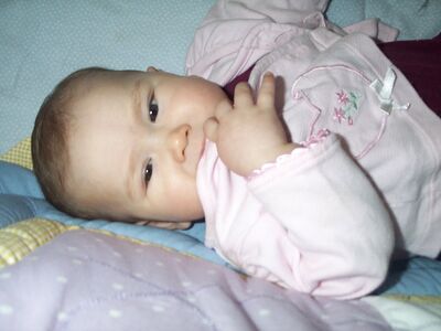 Me in pink outfit eating my jacket