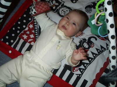 Me in striped outfit on playgym