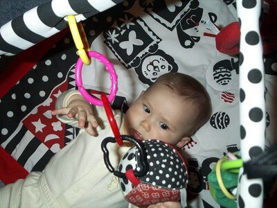 Me in striped outfit on playgym