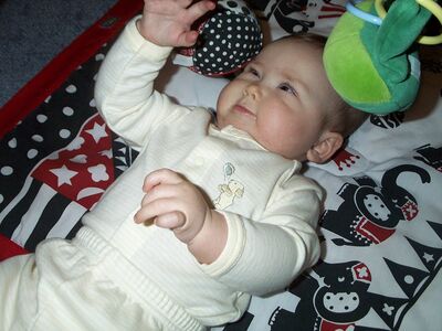 Me in striped outfit on playgym