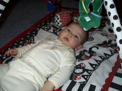 Me in striped outfit on playgym