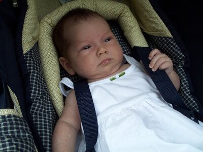 Me in white dress in carseat…Mommy's favorite