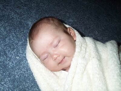 Asleep in blanket (one of Mommy's favorites)