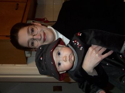 Look at my cute hat…Mommy holding me