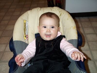 Me smiling in my carseat (cute!)