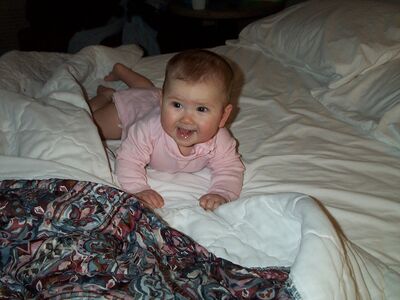 Me smiling on the bed (cute!)