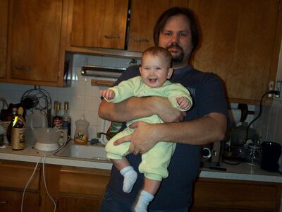 Daddy holding me and I'm laughing