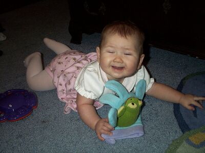 Me in my pink dress with frog eyes closed