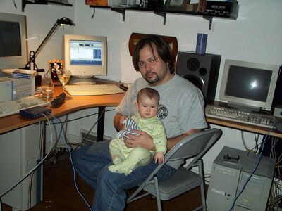 Daddy holding me in the computer room