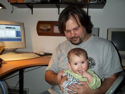 Daddy holding me in the computer room