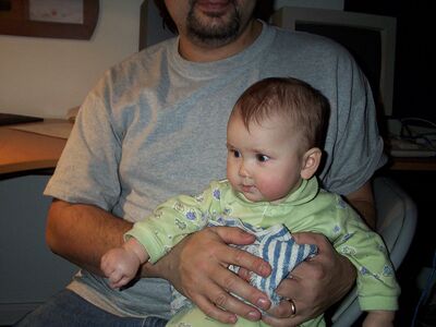 Daddy holding me in the computer room